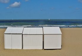 beach huts on a sandy beach on the north sea in belgium