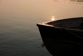 photo of the boat on sunset background