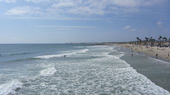 people relaxing on the beach in summer