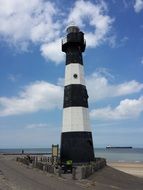 black white lighthouse on the beach