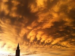 cumulus clouds in colors of bright sunset