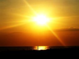 bright sun on an orange sky on the horizon