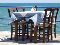 table with chairs by the pool