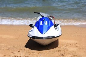 boat stands on a sandy beach