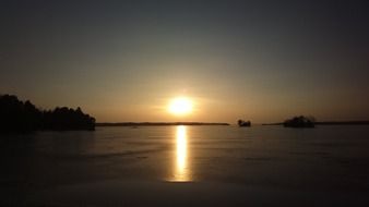 solar path on a frozen lake