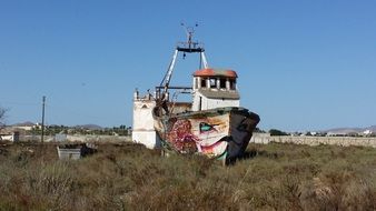 abandoned boat on land