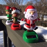 christmas decor, figures of santa and deers on wooden fence