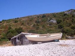 fishing boat on sandy beach