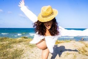 pregnant woman on the beach