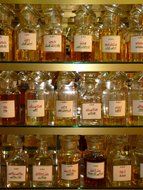 glass bottles on the shelves in the pharmacy