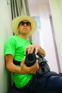 selfie photographer in hat and sunglasses