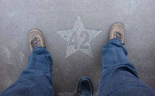 feet at star with a number 42 on the pavement