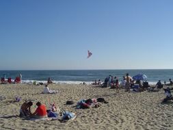 vacationers on a sandy beach in california