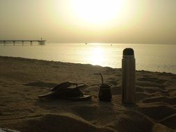 flip-flops and thermos on the beach in Badalona