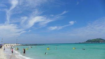panorama of tourists on a summer beach on Jeju Islands