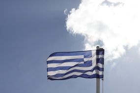 flag of Greece against a white cloud