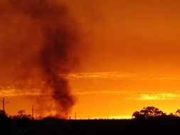 smoke on the orange horizon