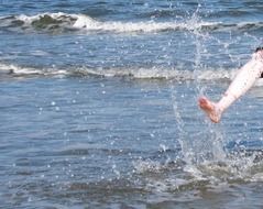 leg in splash of water