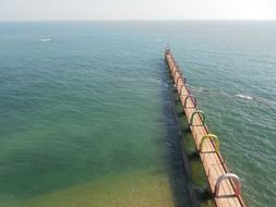 long boardwalk in ocean