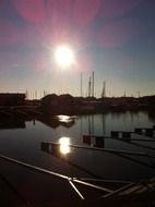 sunny sunset over the boats in the port