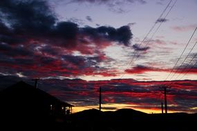 red clouds in the sky at dusk