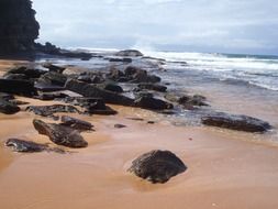 surf among the stones on the beach in sydney