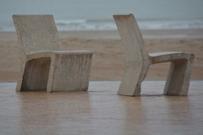 stone chairs on the waterfront