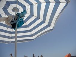 photo of the striped umbrella on a beach
