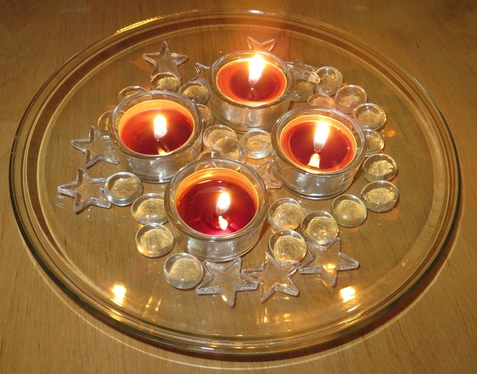 Christmas candles on a transparent dish