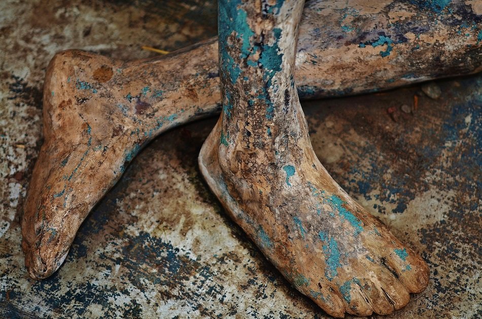 feet of ancient bronze statue
