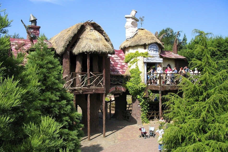 theme park entertainment with thatched roof