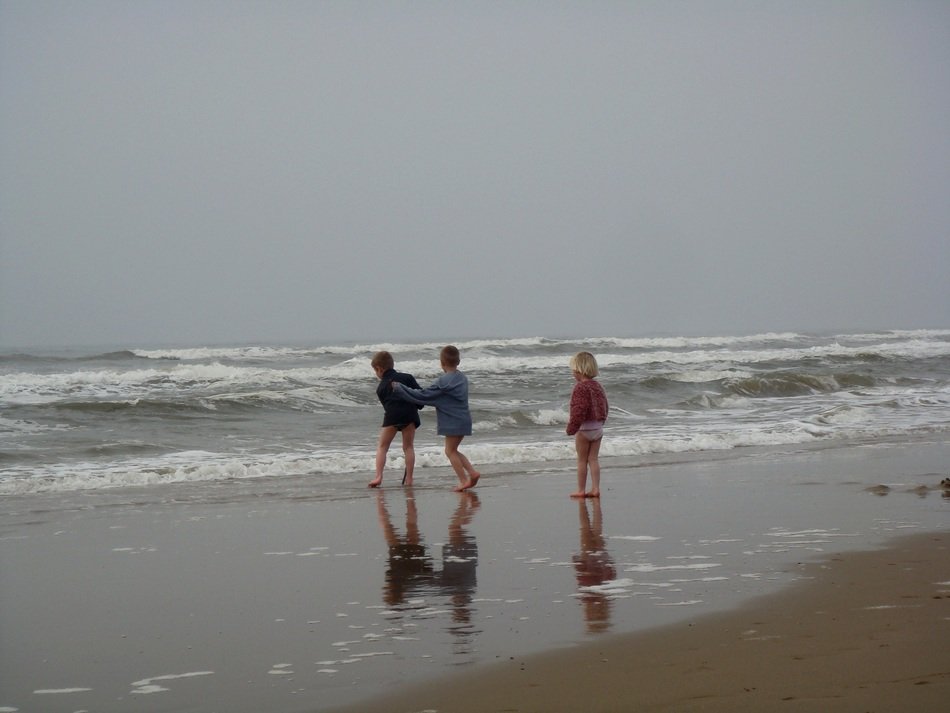 children indulge in the evening beach