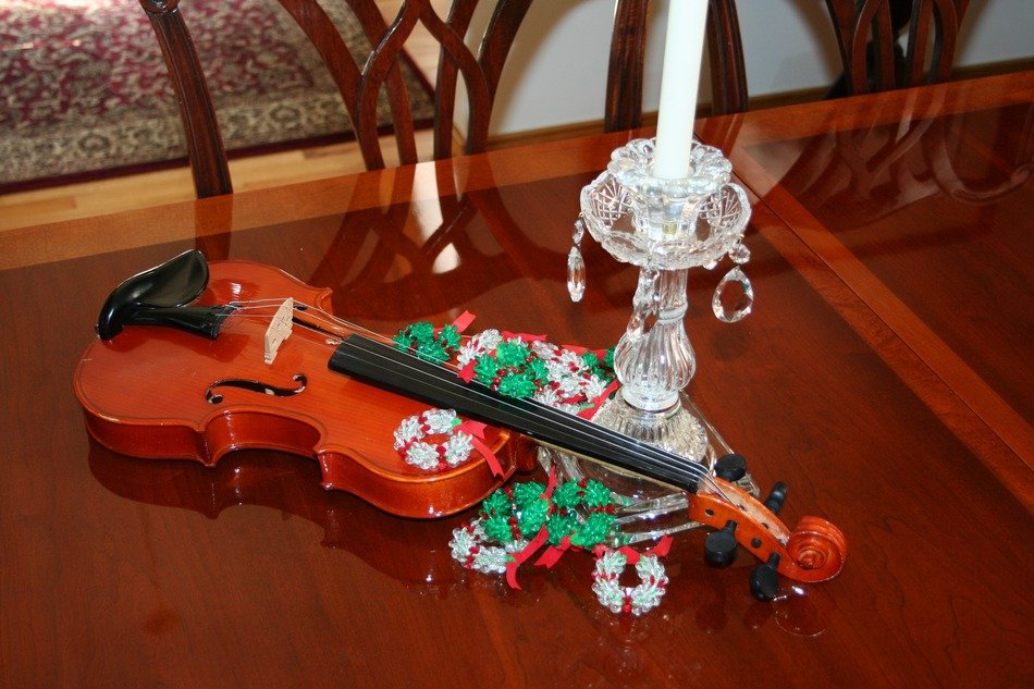 Violin in ornaments on the table