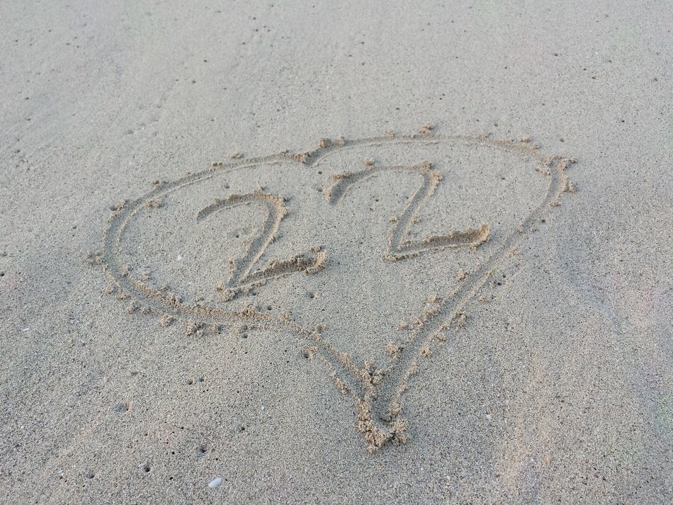 22 lettering and a heart on the sand at the beach