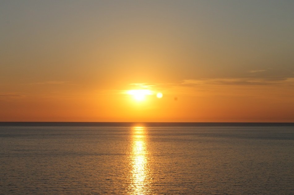 amazing sunset light above the water