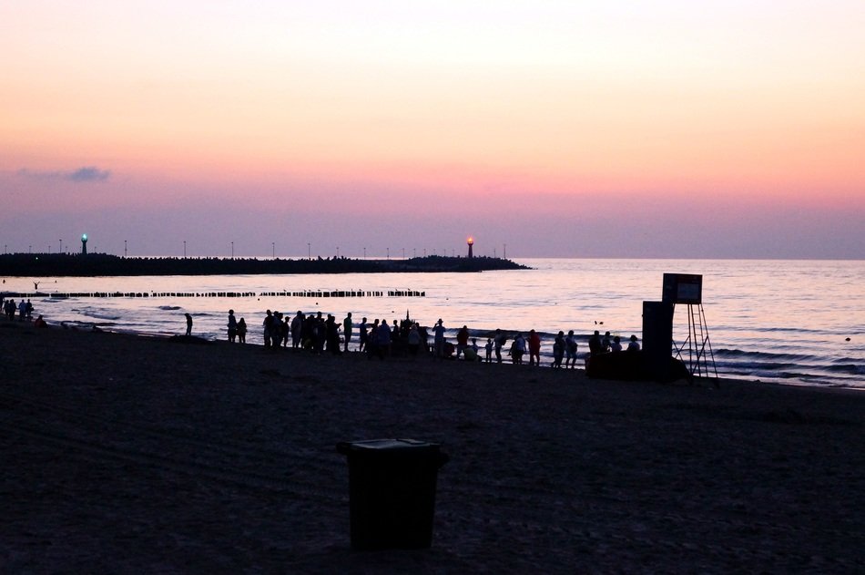 Beautiful colorful beach with the silhouettes