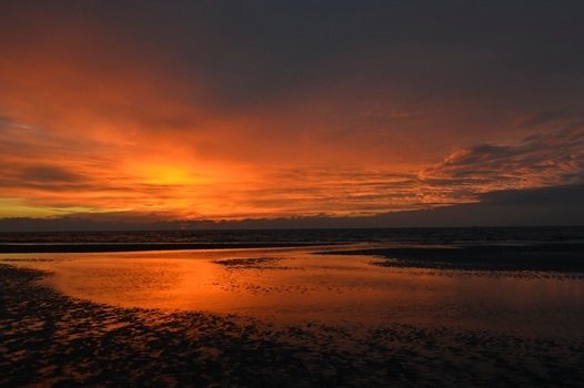 orange sky over the northern sea