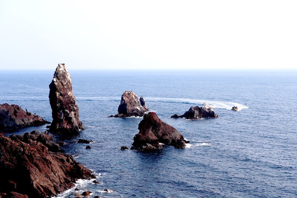 boat and sea rocks