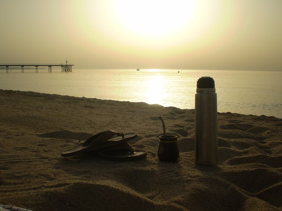flip-flops and thermos on the beach in Badalona