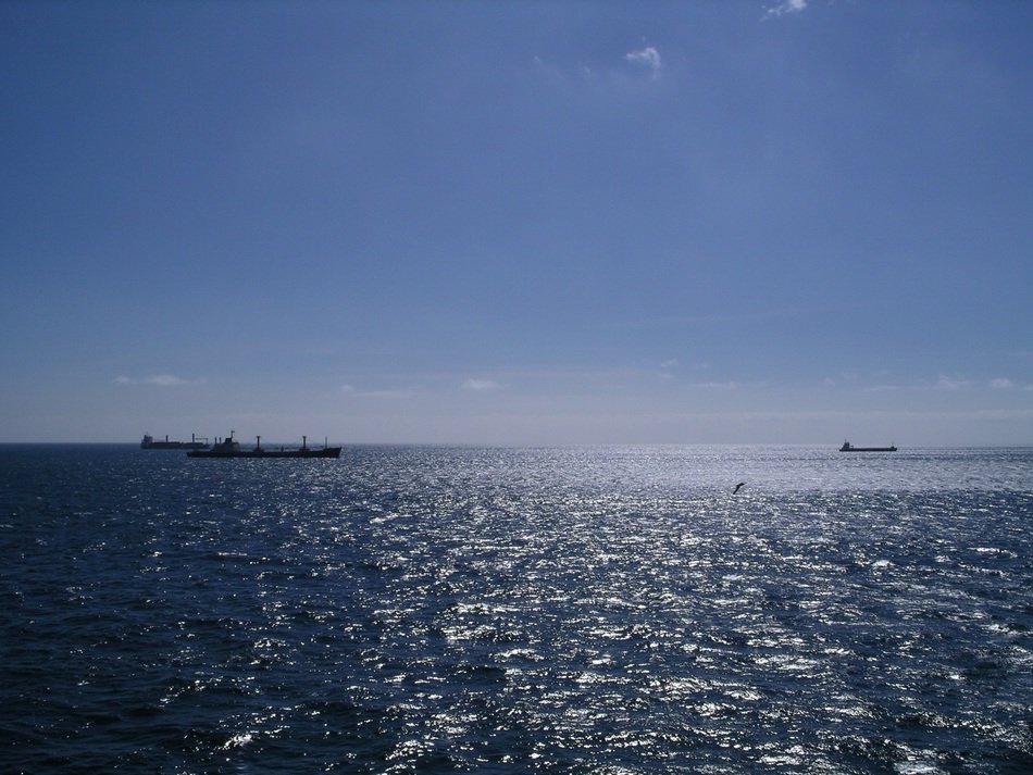 distant view of ships in the atlantic ocean on a sunny day