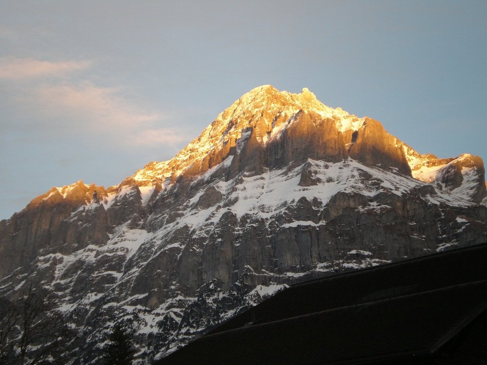 golden peaks of mountains at sunrise in Switzerland