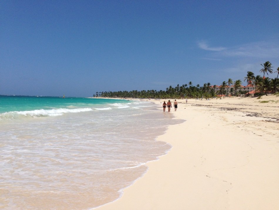 people on the beach of punta cana