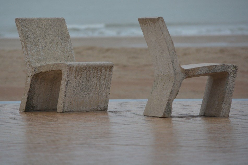 stone chairs on the waterfront