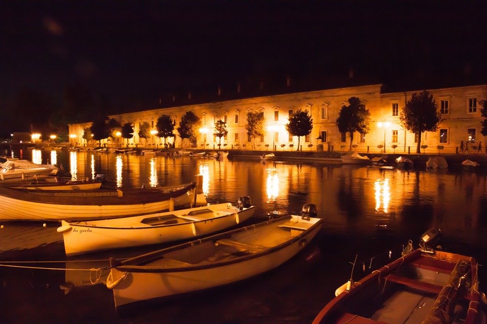 boats in the lit harbor