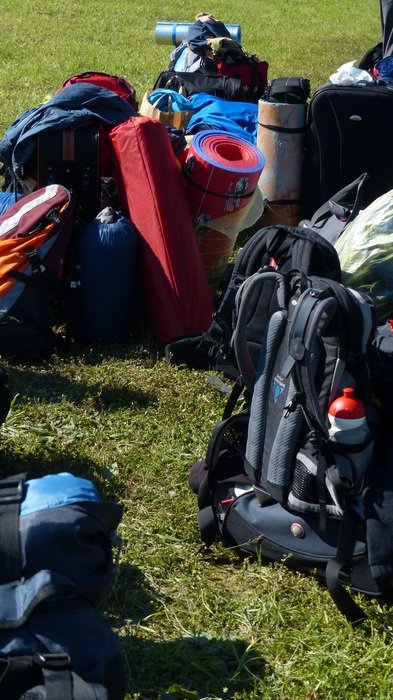 backpacks for traveling on green grass