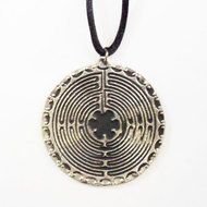 silver pendant in graphic representation