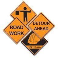 variety of signs for road works