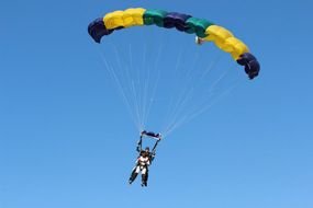 jump with a striped parachute