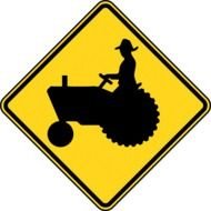 worker on a tractor on a yellow sign