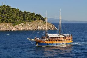 ship with tourists on sea at coastline, croatia